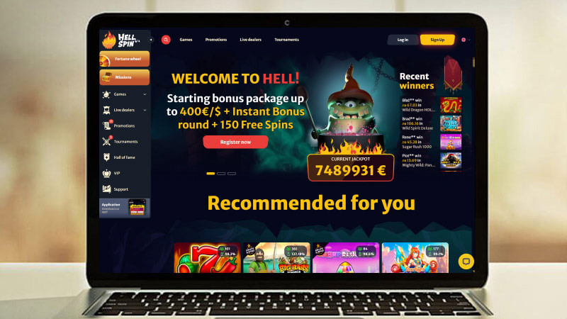 Скрийншот на главната страница на Казино HellSpin на екрана на лаптопа
